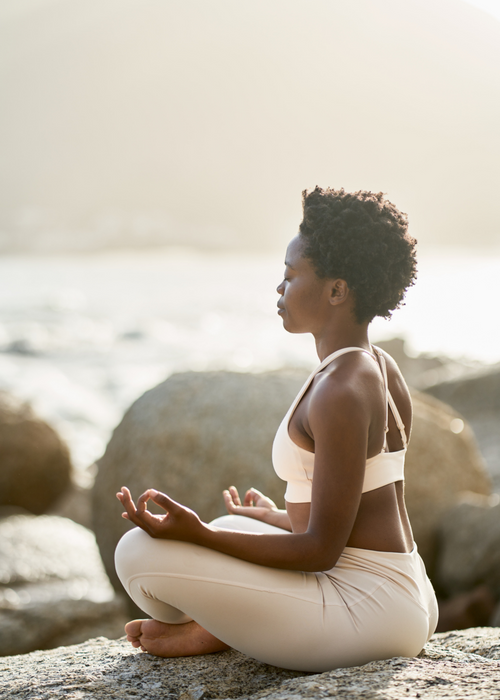 Woman meditating in the morning outside