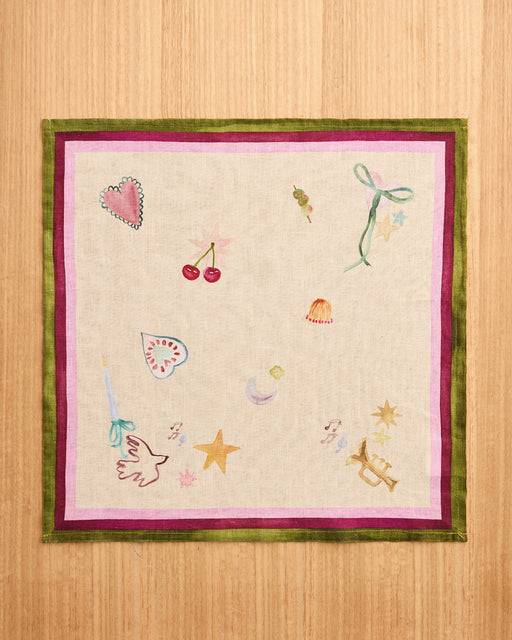 Bed Threads’ La Fête 100% French Flax Linen Napkins (Set of Four) feature a cream base with green and purple borders and lively, colorful illustrations—ideal for festive table decor or charming holiday napkins.