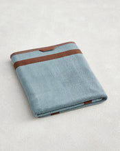 The Bed Threads Cacao & Lagoon Two-Toned 100% Cotton Terry Bath Sheet features plush, quick-drying cotton in light blue with brown stripes—ideal for a stylish and practical addition to your bath routine. - view