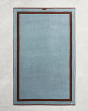 Elevate your bathroom with Bed Threads’ Cacao & Lagoon Two-Toned 100% Cotton Terry Bath Sheets (Set of Two), featuring a stylish rectangular design in light blue with dark brown borders—luxurious, soft, and perfect for your towel collection. - view