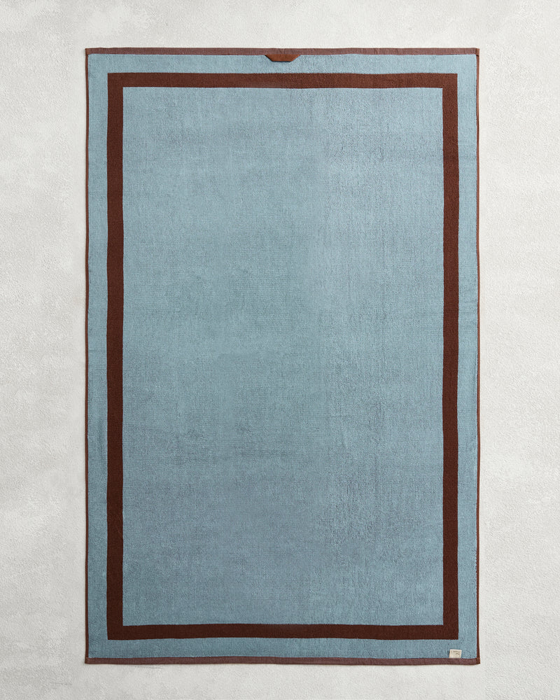 Elevate your bathroom with Bed Threads’ Cacao & Lagoon Two-Toned 100% Cotton Terry Bath Sheets (Set of Two), featuring a stylish rectangular design in light blue with dark brown borders—luxurious, soft, and perfect for your towel collection.