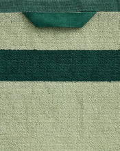 Close-up of the Bed Threads Forest & Sage Two-Toned 100% Cotton Terry Bath Towel, featuring a textured terry surface, light green with a dark green stripe and hanging loop—ideal for your bath towel bundle. - view